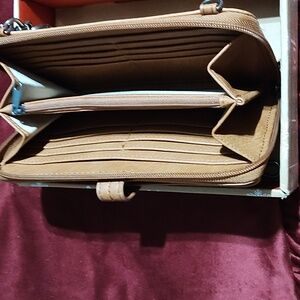 Wallet, tan in color.gentle used